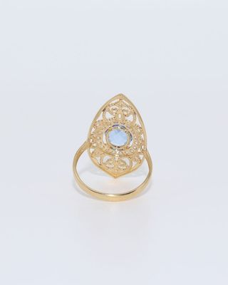 LANZADERA PEQUEÑA PIEDRA AZUL Y CIRCONITAS 18K