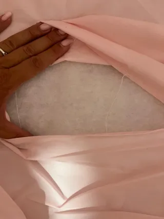 Minicuna madera blanca y tejido rosa con ruedas