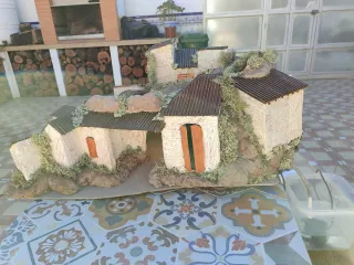 Belén casas con luz y río