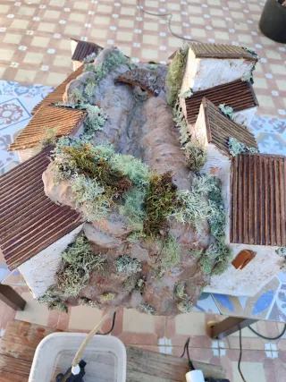 Belén casas con luz y río