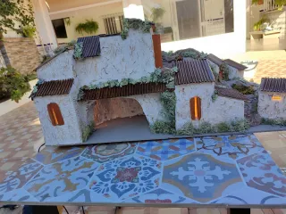 Belén casas con luz y río