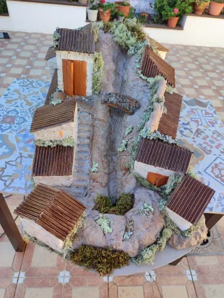 Belén casas con luz y río