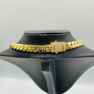 CADENA CUBANA,HUECA CON CIERE CIRCONITA ORO 18K.