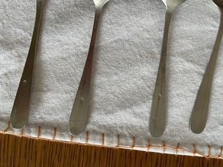 Juego de 10 cucharas antiguas de alpaca con sello