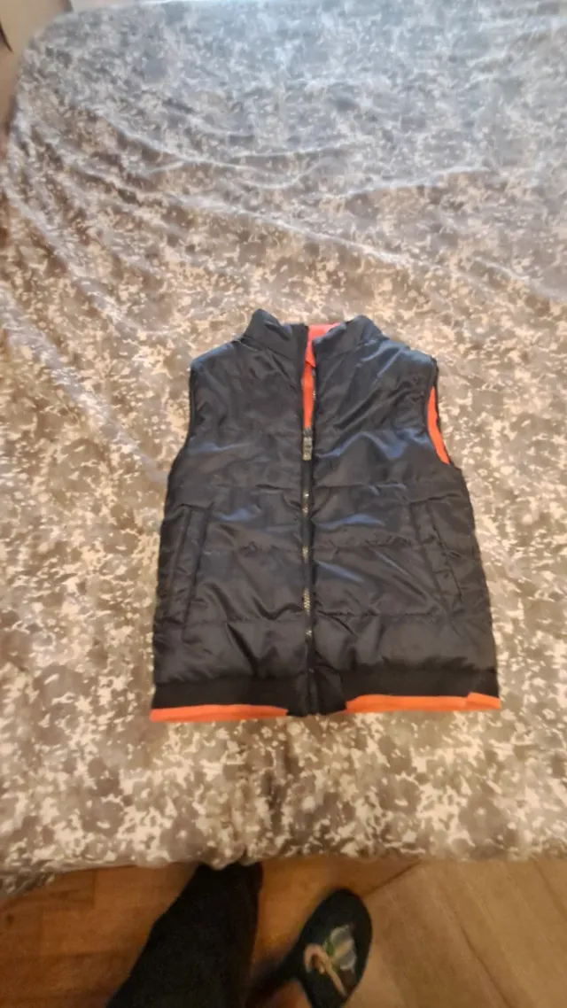 Chaleco infantil reversible negro y naranja