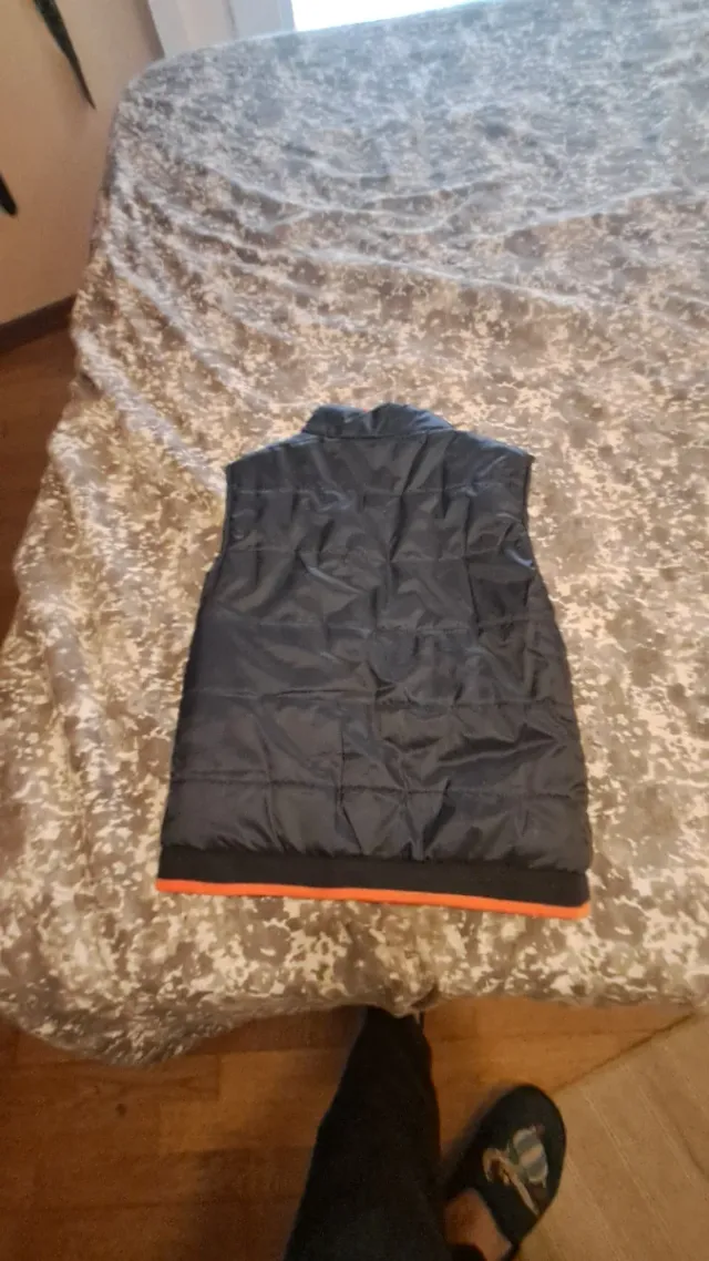 Chaleco infantil reversible negro y naranja