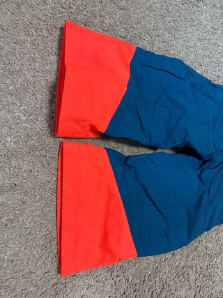 Mono de esquí naranja y azul talla 4 años 98-104cm