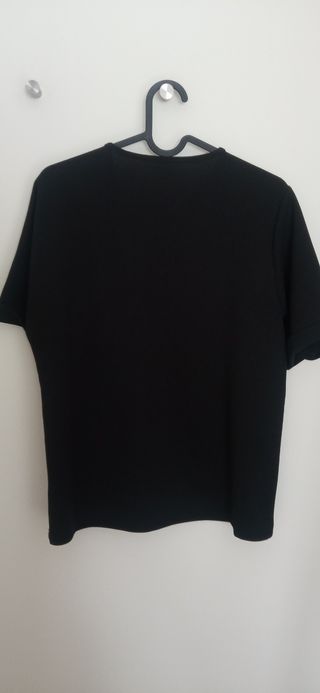 Top negro mujer manga corta detalle nudo en escote