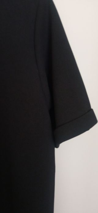 Top negro mujer manga corta detalle nudo en escote