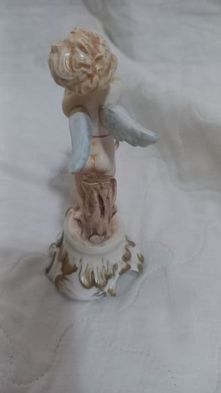 Statuina angioletto con corno in ceramica