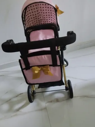 Cochecito de muñecas rosa