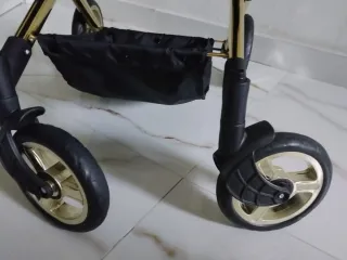 Cochecito de muñecas rosa