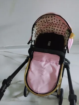 Cochecito de muñecas rosa