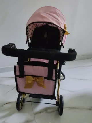 Cochecito de muñecas rosa