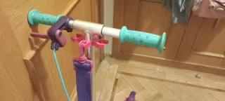 Patinete Oxelo rosa con correa y freno