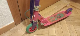 Patinete Oxelo rosa con correa y freno