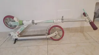 Patín Oxelo Mid9 blanco y rosa