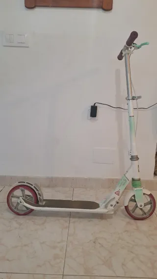 Patín Oxelo Mid9 blanco y rosa