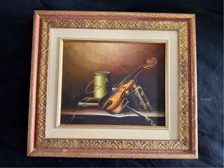 Cuadro de violín y libros