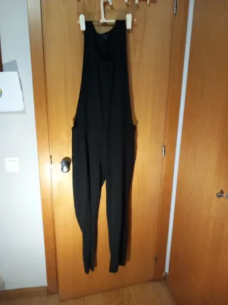 Mono negro tirantes de arreglar