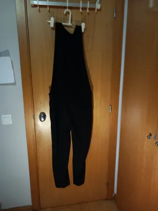 Mono negro tirantes de arreglar