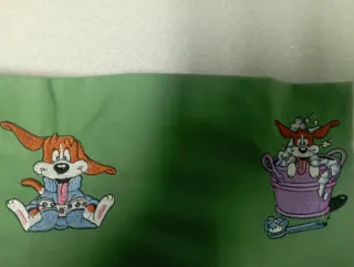Funda bordada a máquina con perros