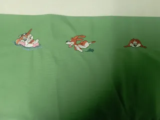 Funda bordada a máquina con perros