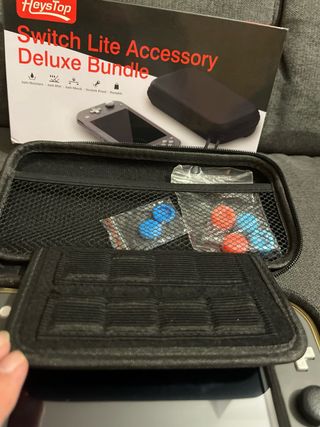 Nintendo Switch Lite + Accesorios y Juegos
