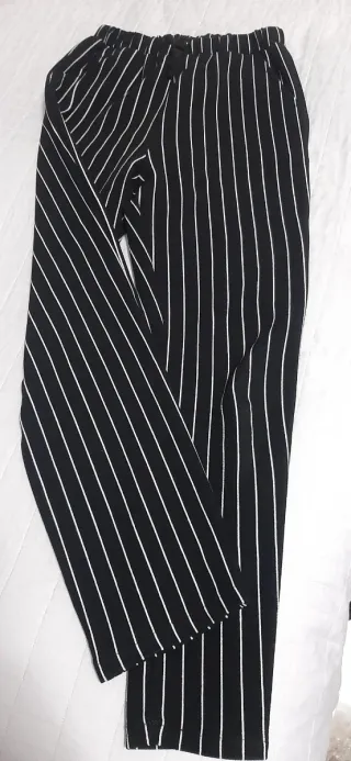 Pantaloni neri a righe bianchetaglia 11/12anni