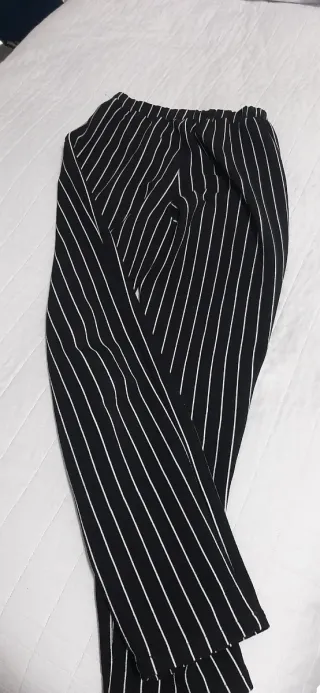 Pantaloni neri a righe bianchetaglia 11/12anni