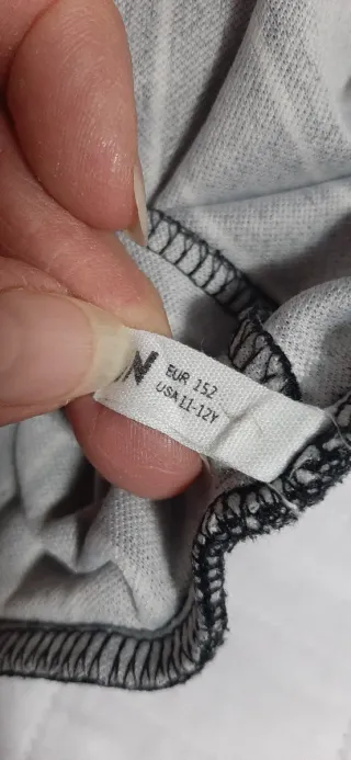 Pantaloni neri a righe bianchetaglia 11/12anni