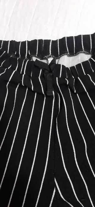 Pantaloni neri a righe bianchetaglia 11/12anni