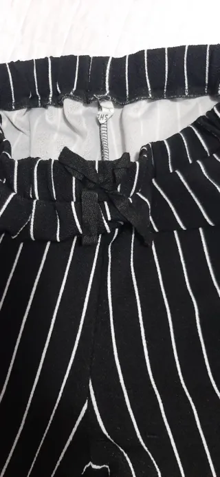 Pantaloni neri a righe bianchetaglia 11/12anni