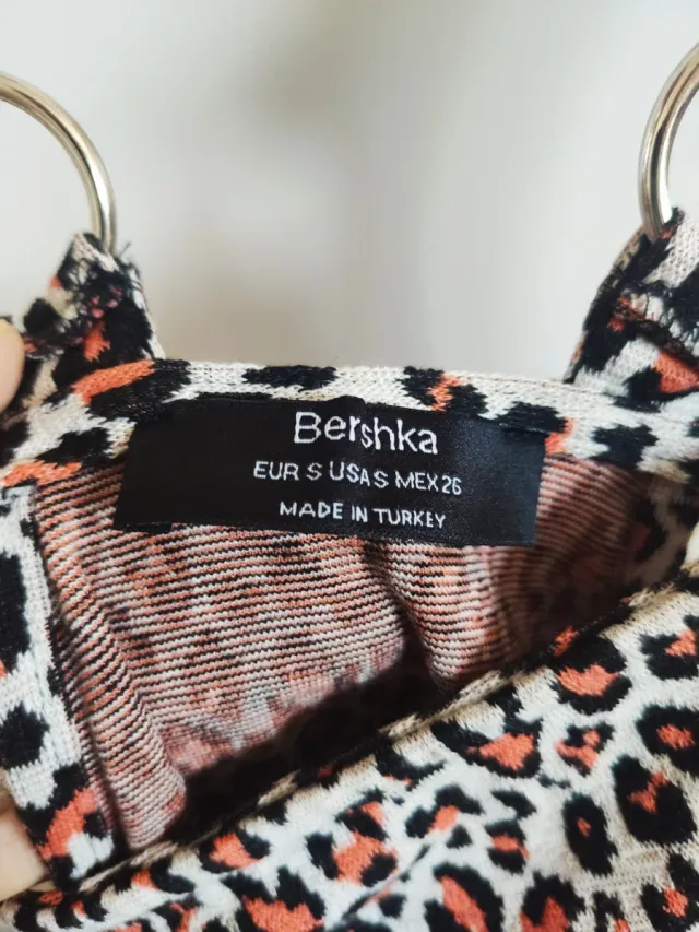 Peto animal print beige y naranja