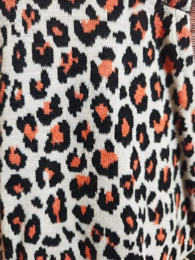 Peto animal print beige y naranja