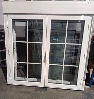 Ventana doble hoja con cajón persiana