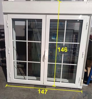 Ventana doble hoja con cajón persiana