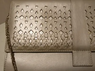Cartera de piel dorada para eventos