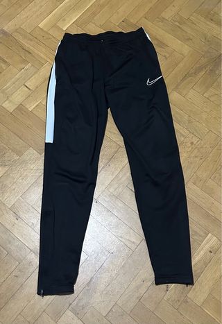 Pantalón chándal Nike negro franja blanca