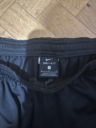 Pantalón chándal Nike negro franja blanca