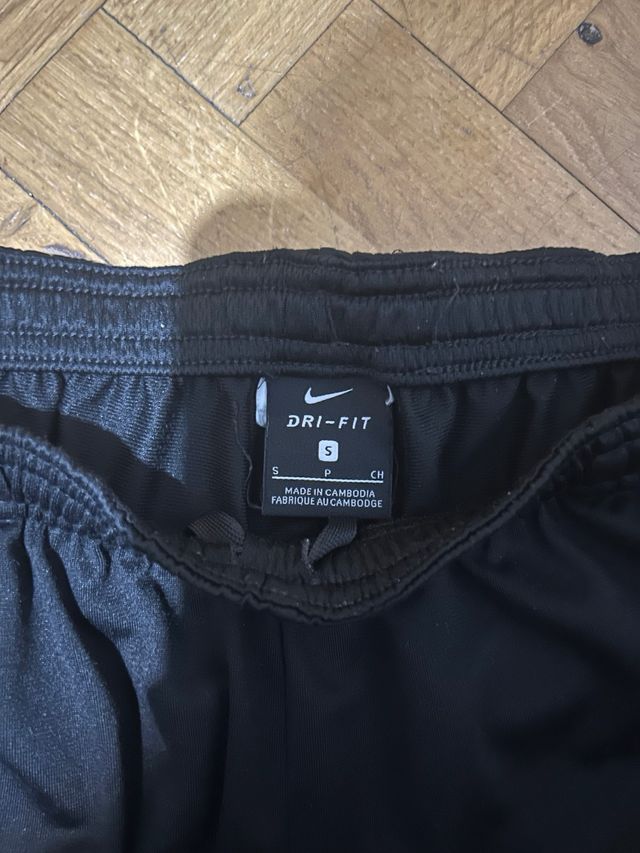 Pantalón chándal Nike negro franja blanca