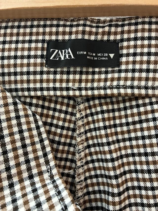 Pantalones de cuadros beige y negro