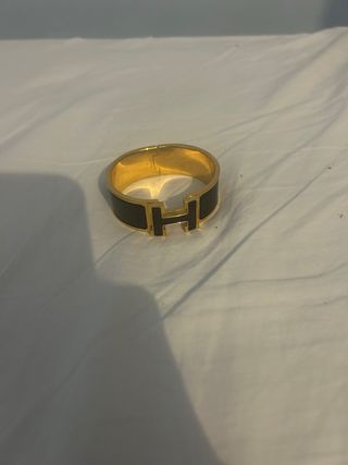 Brazalete Hermès Clic Clac H Dorado Negro