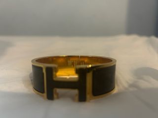 Brazalete Hermès Clic Clac H Dorado Negro
