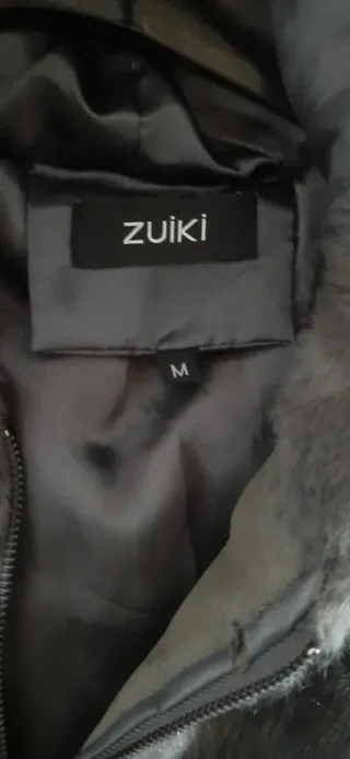 Pellicciotto ecologico grigio con cappuccio