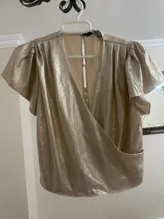 Top dorado brillante