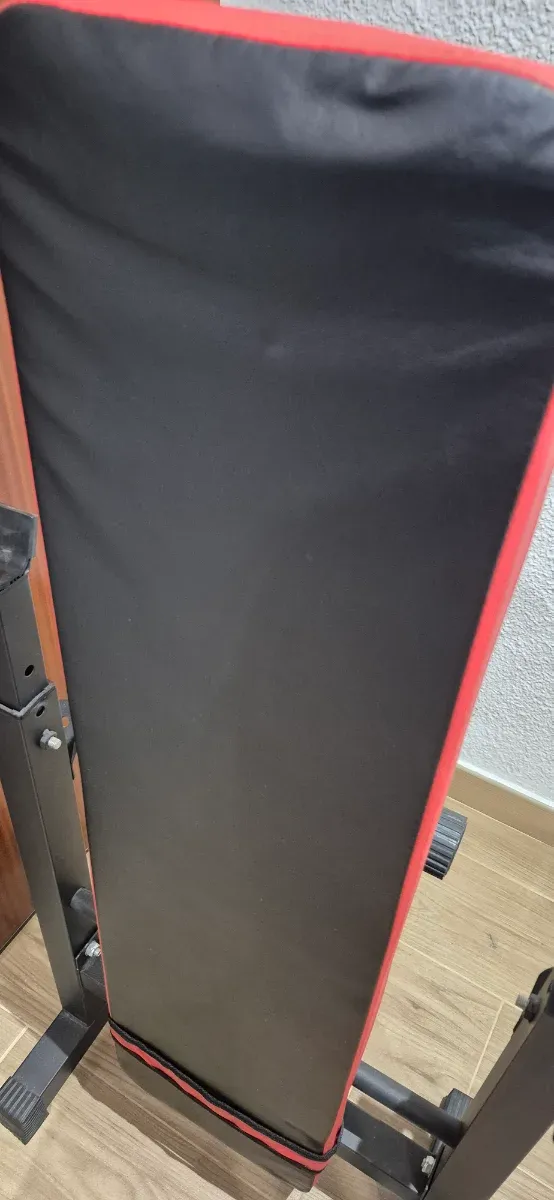 Banco de pesas plegable, mancuernas y barra z.