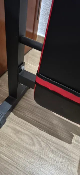 Banco de pesas plegable, mancuernas y barra z.