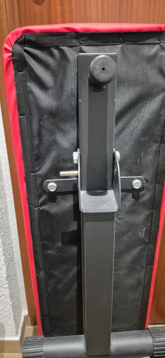 Banco de pesas plegable, mancuernas y barra z.