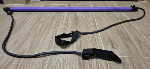 Barra de ejercicio con elástico púrpura